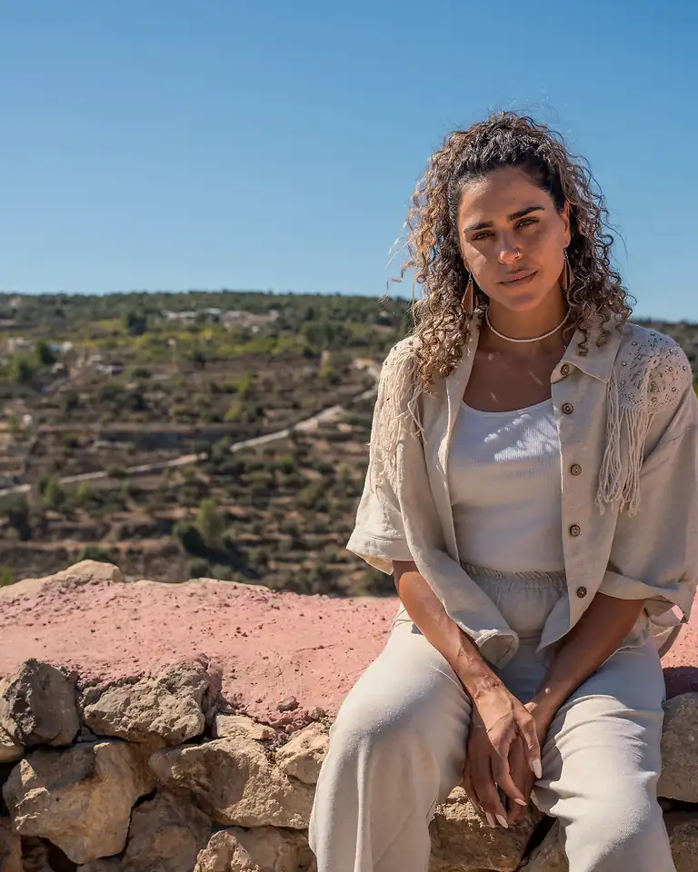 Alice Kisiya, founder of the Save Al-Makhrour Initiative, on her family's land near Beit Jala