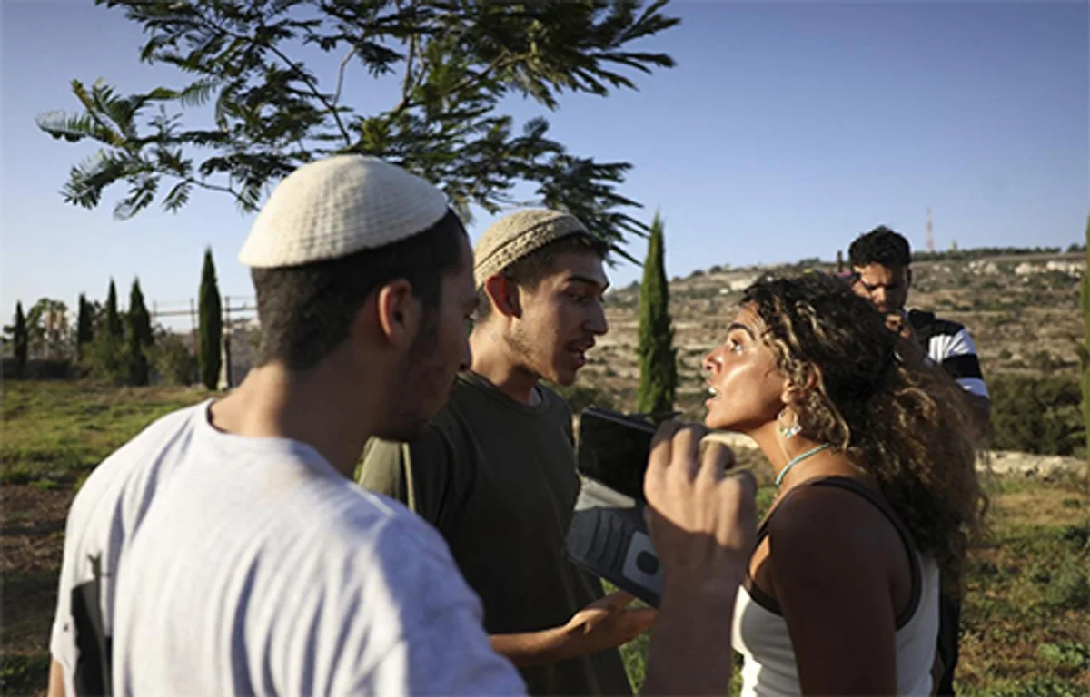 Alice Kisiya face to face with Israeli settlers on her family's land